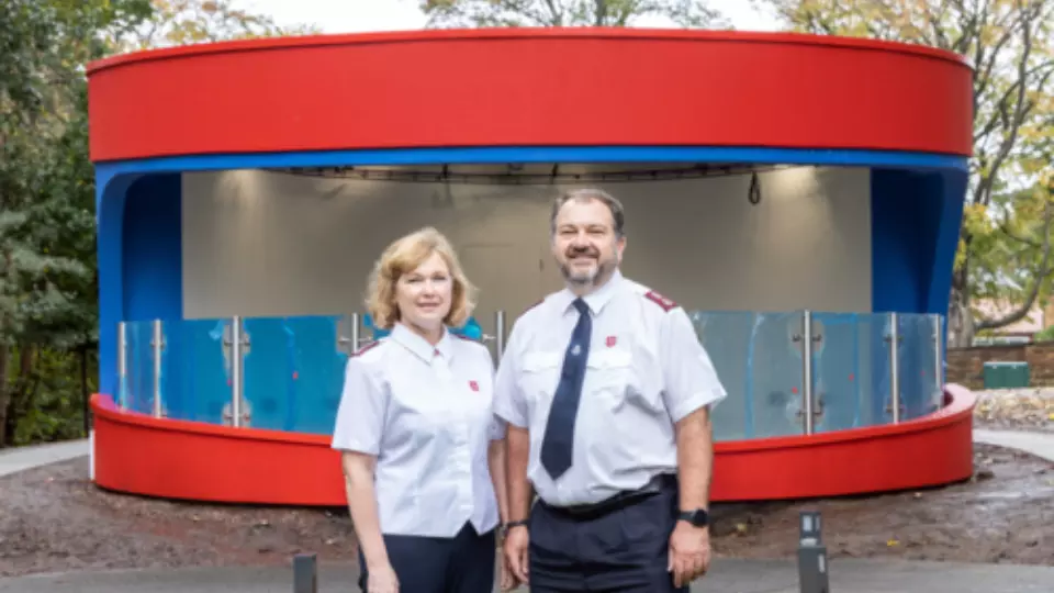 Major Kathy Versfeld and Allistair Versfeld outside the almost complete new bandstand at Strawberry Field