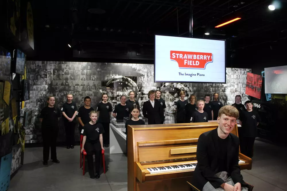 Joe Worthington, LIPA and The Liverpool Signing Choir alongside Julia Baird and Kathy Versfeld at John Lennon's 'Imagine' piano