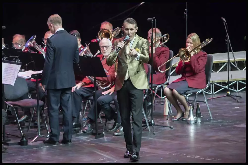 Asa Murphy sings with the Walton Salvation Army band at Celebrating Christmas with Strawberry Field