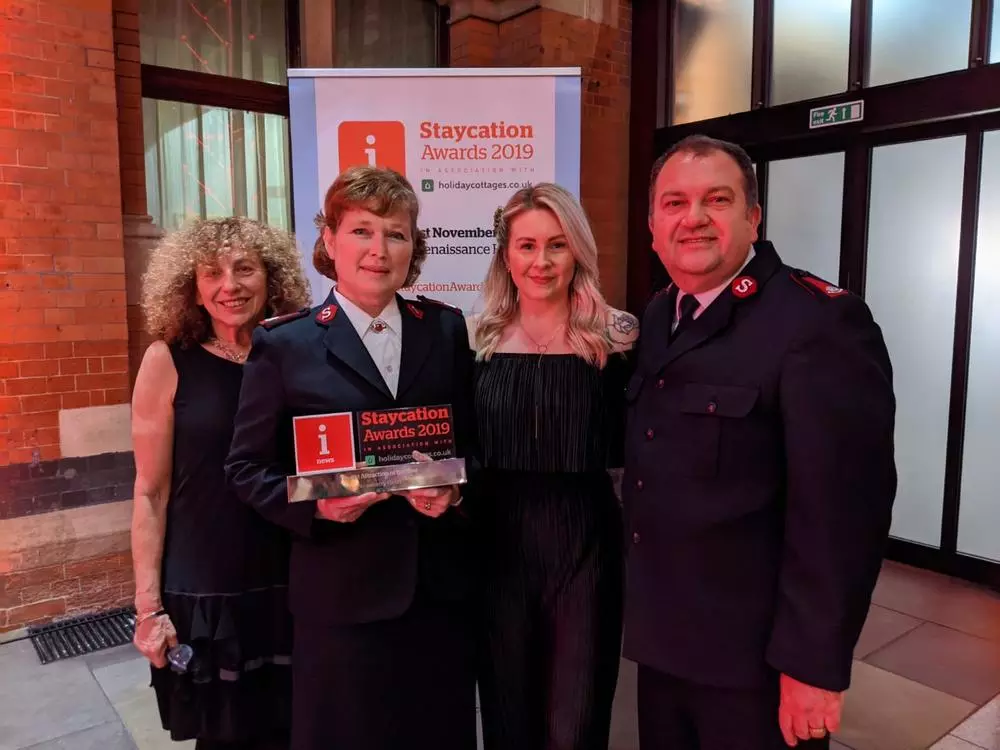 Ginette Goulston-Lincoln - Travel Trade Consultant, Major Kathy Versfeld - Mission Director, Laura Taylor - Marketing & Communications Manager, Major Allister standing at the Staycation Awards 2019 with the winning trophy.