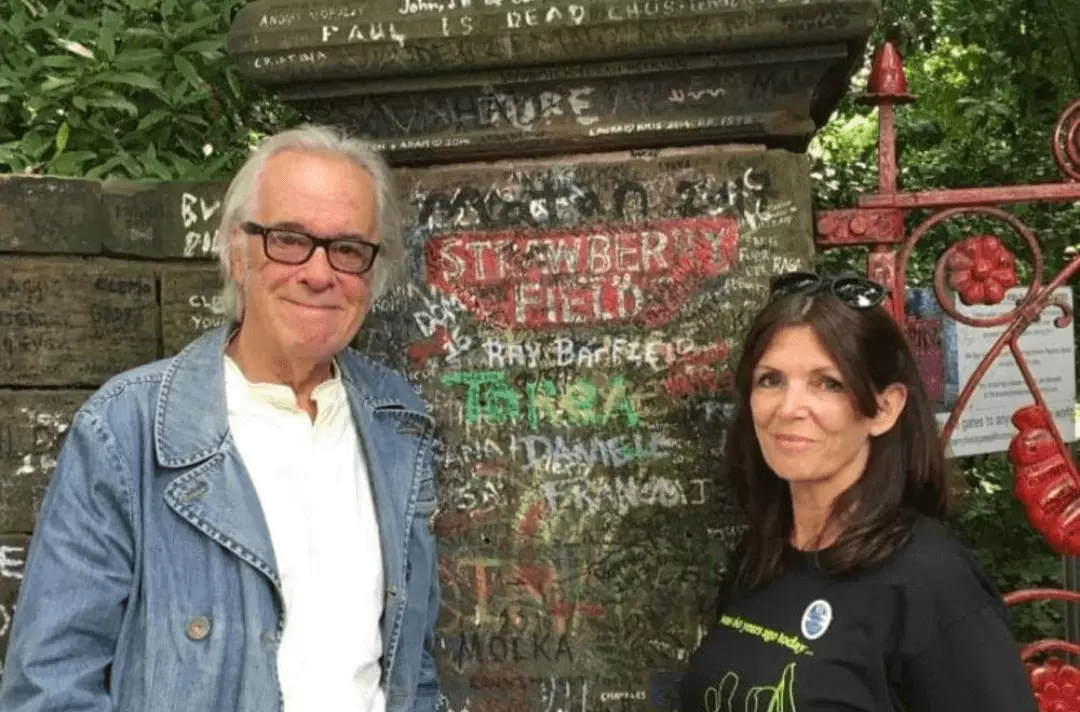 Tony Bramwell with Beatles tour guide Jackie Spencer at the Strawberry Field Liverpool gates