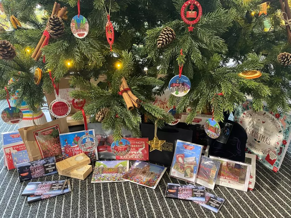 Christmas gifts underneath a decorated tree at Strawberry Field