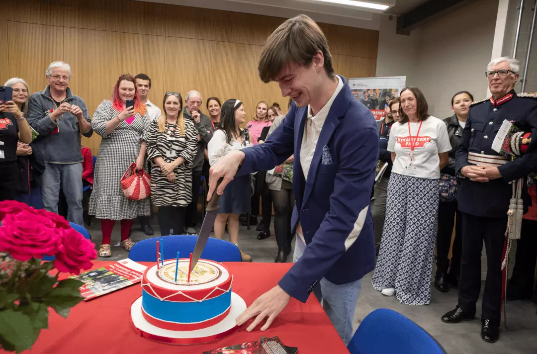 Jake cuts a cake