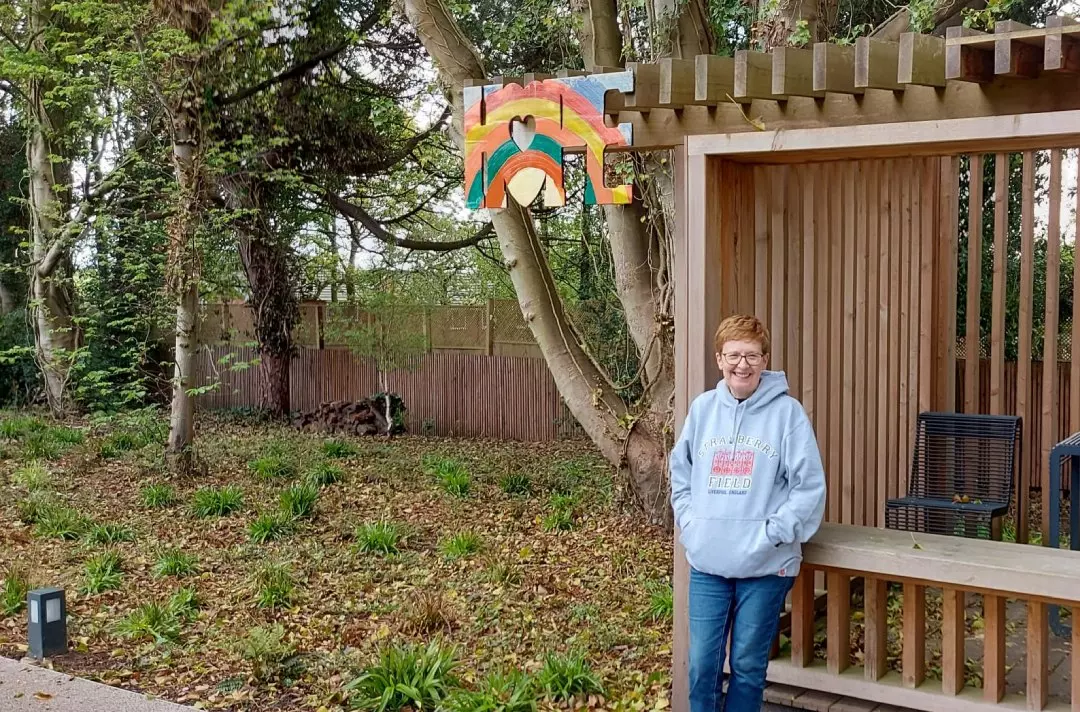 Karen standing by the hope sign
