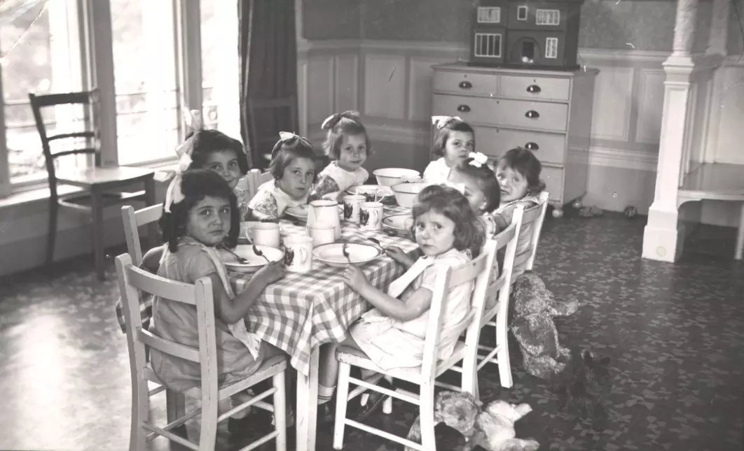 Children sat around the dinner table