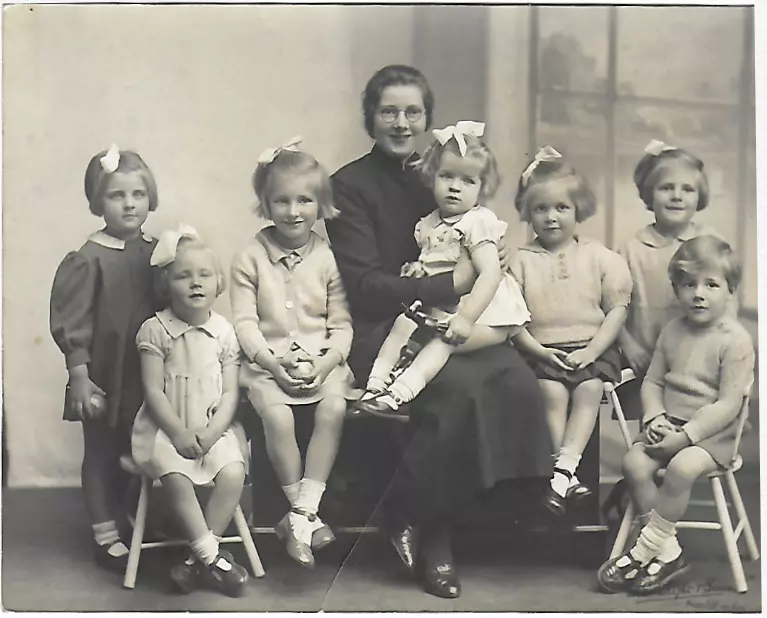 Children sit on an officers knee at Strawberry Field Children's Home