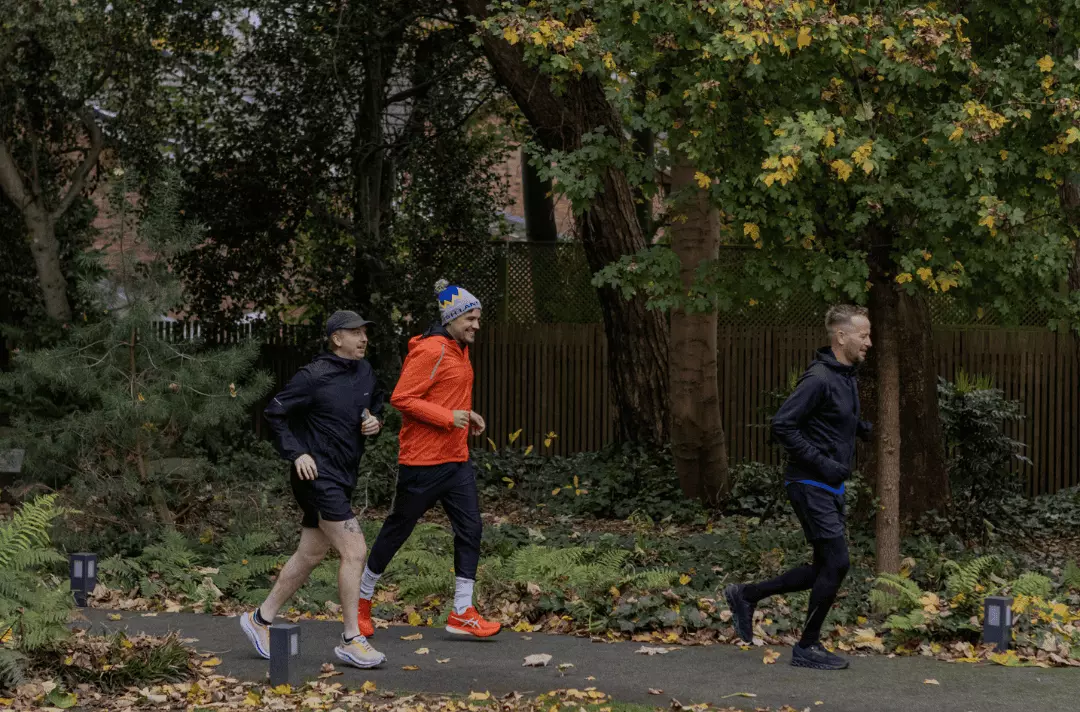 Martin, James and Neil run around the garden
