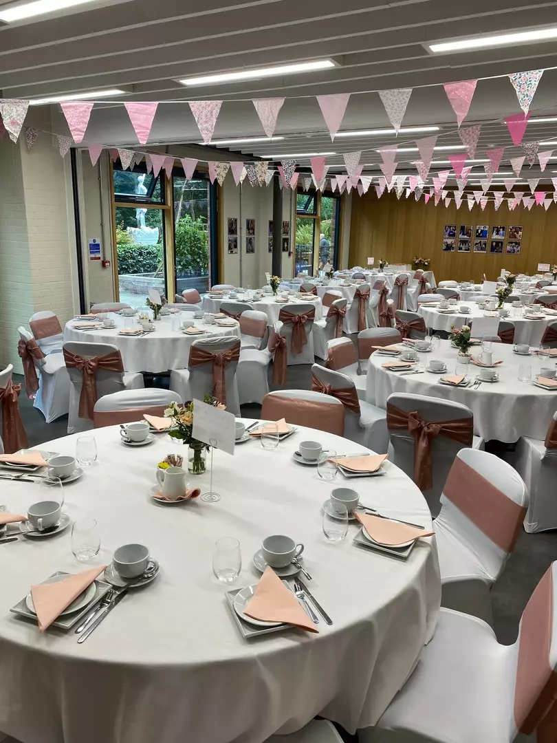 Bradbury Suite full of round tables and chairs dressed with table clothes