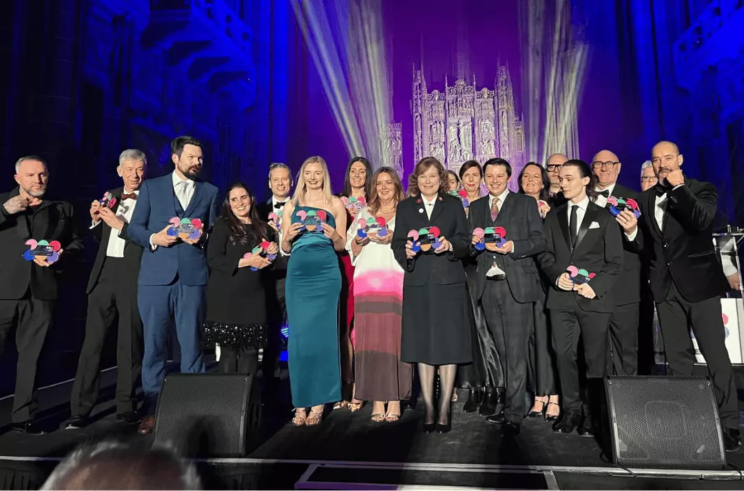 Group photo of the Strawberry Field team and other award winners on stage at the LCR Tourism Awards