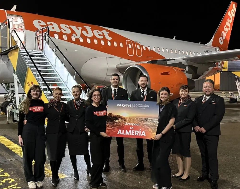 Strawberry Field and EasyJet staff stand in front of the first EasyJet flight to Almeria from Liverpool