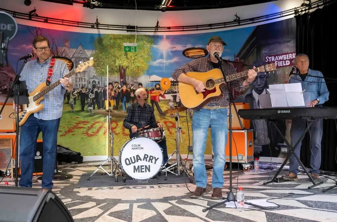 The Quarrymen band play on the Strawberry Field Bandstand